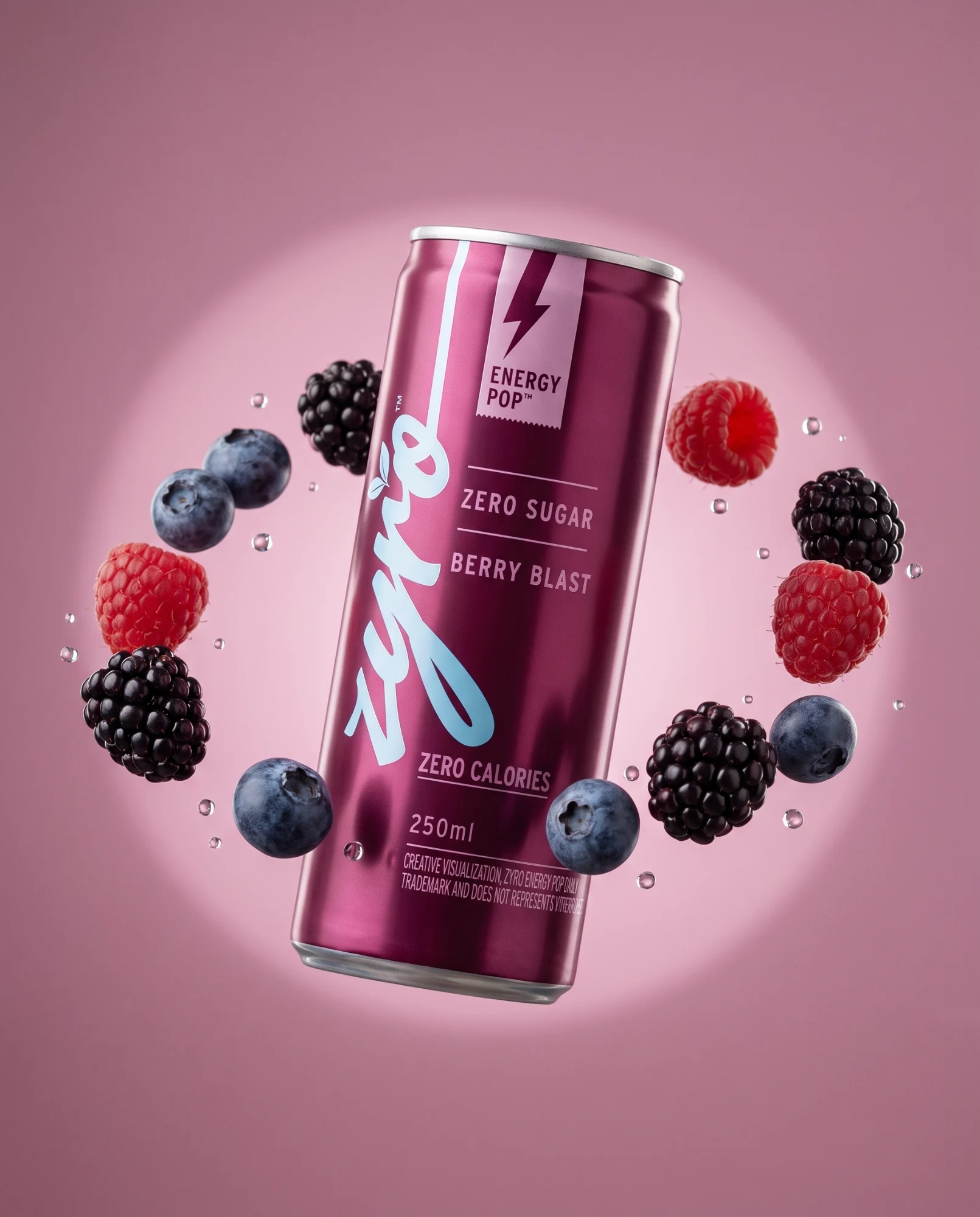 The berry can floats in a ring of raspberries, blackberries and blueberries on a pink ground.